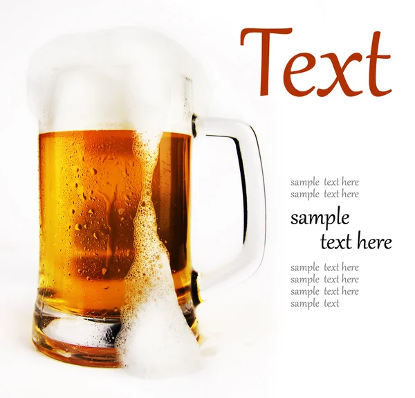 Cold glass of beer with foam — Stock Photo, Image