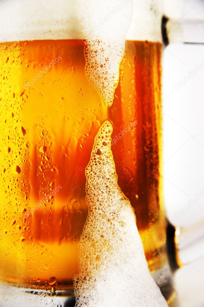 Cold glass of beer with foam