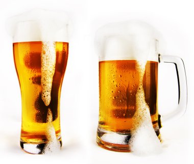 Cold glass of beer with foam clipart