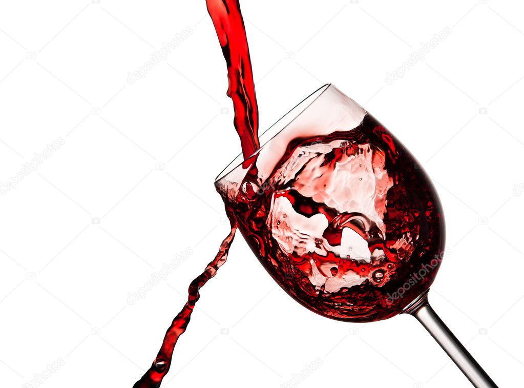 Red wine poured into crystal glass
