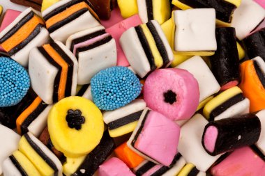 Different all sorts sweets in a pile clipart