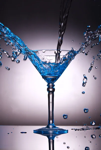 Martini glass with water splash — Stock Photo, Image