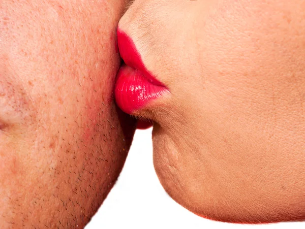 Woman kissing man's cheek — Stock Photo, Image