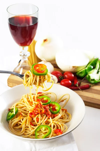 Spicy italian pasta tomato and chili peppers sauce — Stock Photo, Image