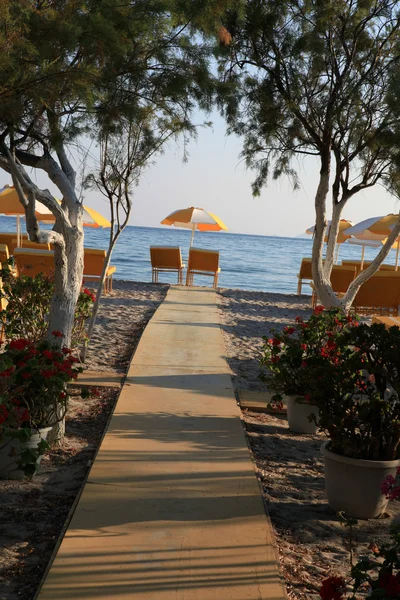 Two chairs and umbrella on the beach . Tigaki,Greece — Stock Photo, Image