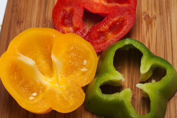 Close up of red, yellow and green peppers — Stock Photo, Image
