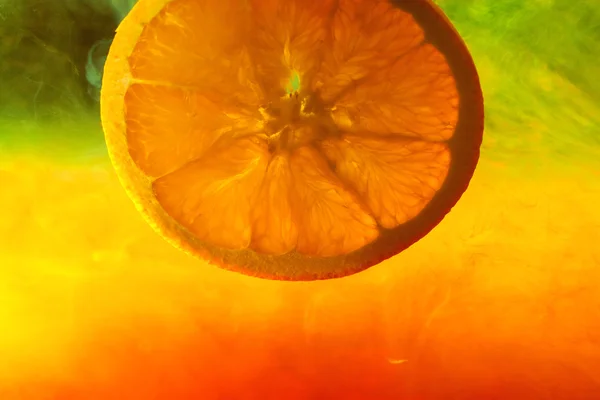 stock image Orange on abstract color background