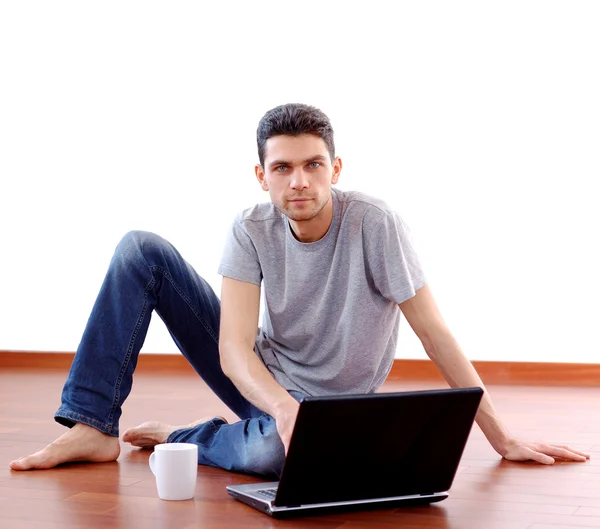 Young Man Sitting with Laptop at Home — Stock Photo, Image