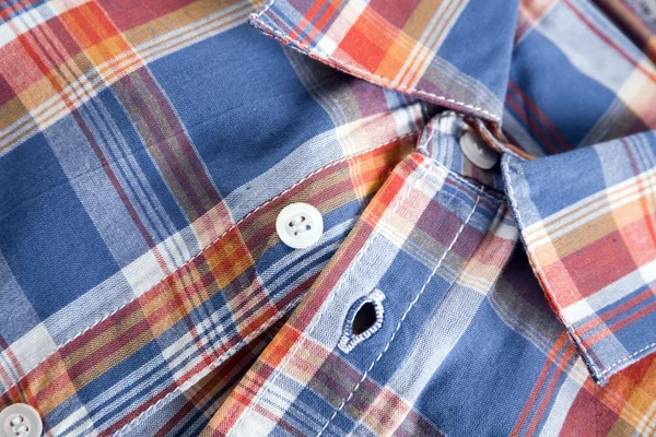 Bright multi-colored plaid shirt with a collar