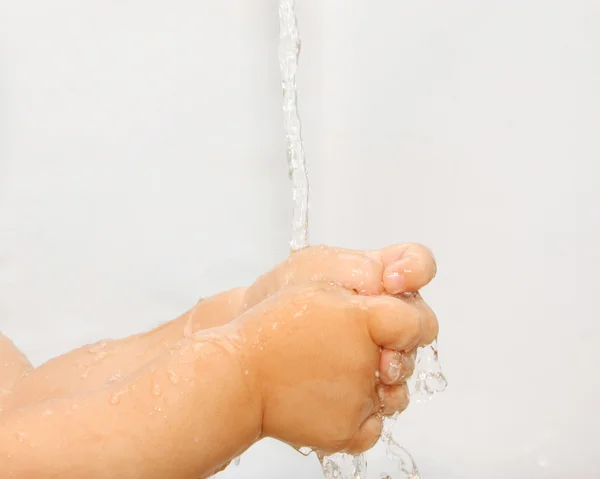 stock image Little boy washes hands in a bathroom