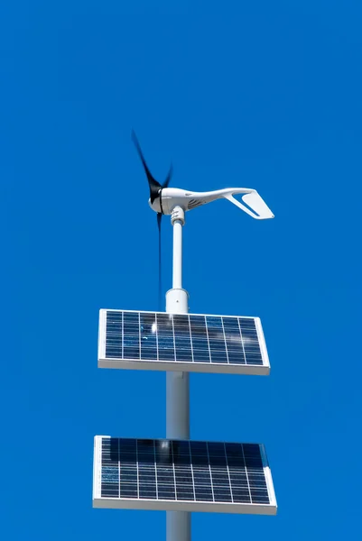 Wind generator and solar panels — Stock Photo, Image