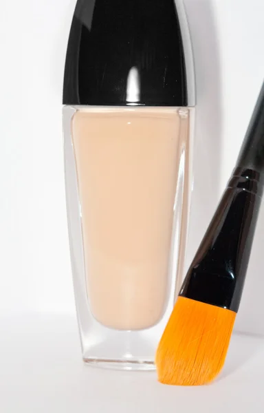 Professional foundation brush and tone creme bottle — Stock Photo, Image