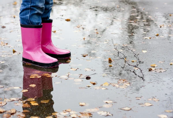 Boots in a puddle — Stock Photo, Image