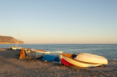 Fishing boats at sunset clipart