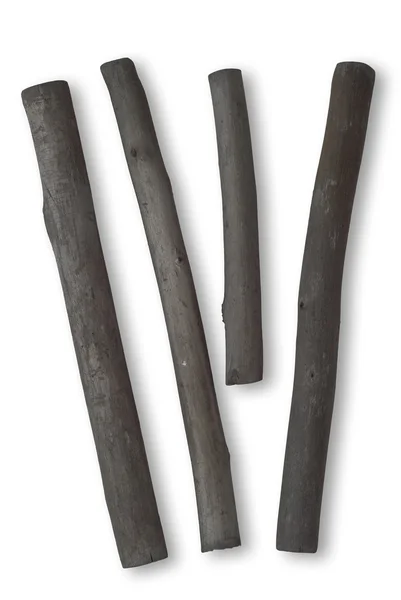 Cuatro palos de carbón en blanco — Foto de Stock