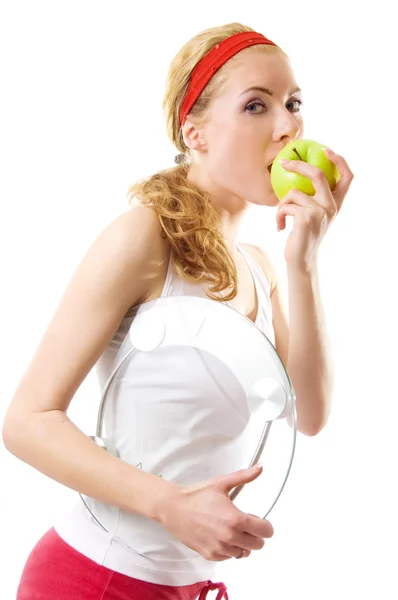Mulher desportiva com escala e maçã verde — Fotografia de Stock