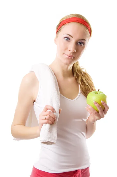 Donna sportiva con asciugamano e mela verde — Foto Stock