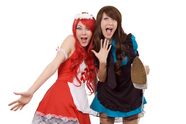 Två chockade tjänare flickor med järn — Stockfoto