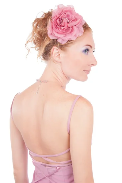 Mulher de vestido rosa e com as costas — Fotografia de Stock