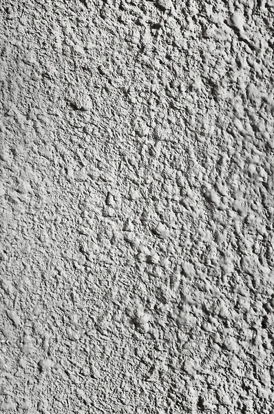 Un guijarros, textura gris blanco arenoso o fondo . — Foto de Stock