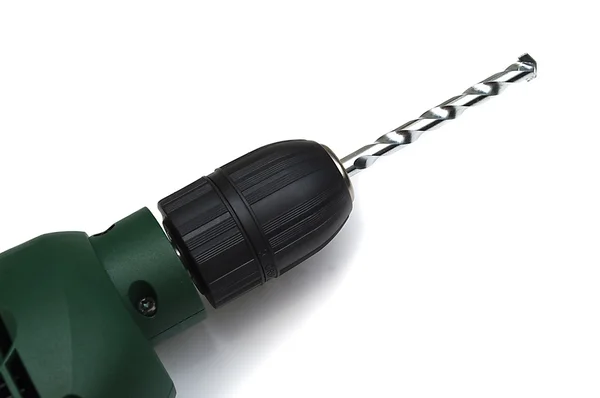 Green drill with a drill on a white background — Stock Photo, Image