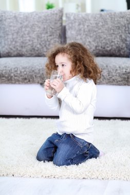 Little girl drinking water clipart