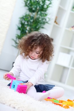 Child with cubes clipart