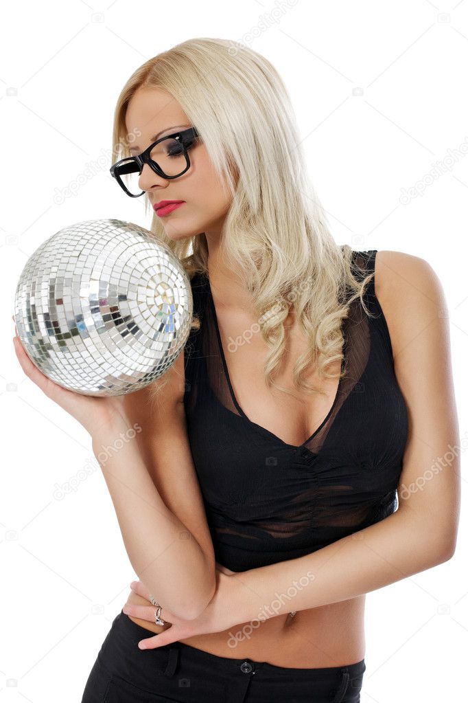 Sensual young woman holding disco ball