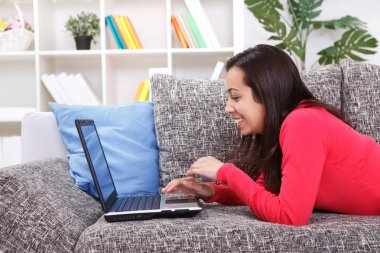 Young woman spending time on laptop computer clipart