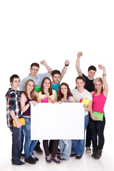 Happy students with white board — Stock Photo, Image