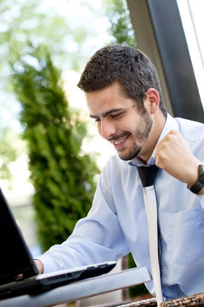 Happy businessman browsing on internet — Stock Photo, Image
