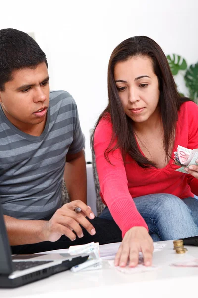 Desperate couple looking at their bills — Stock Photo, Image