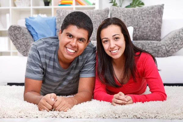 Happy couple smiling together at home — Stock Photo, Image