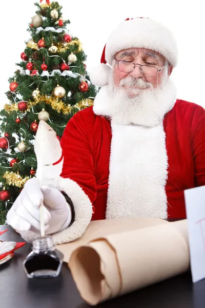 Santa skriva önskelista — Stockfoto