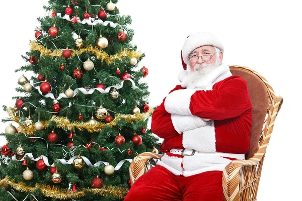 Weihnachtsmann sitzt im Schaukelstuhl — Stockfoto