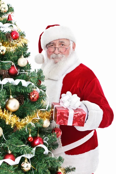 Smiling Santa with present — Stock Photo, Image
