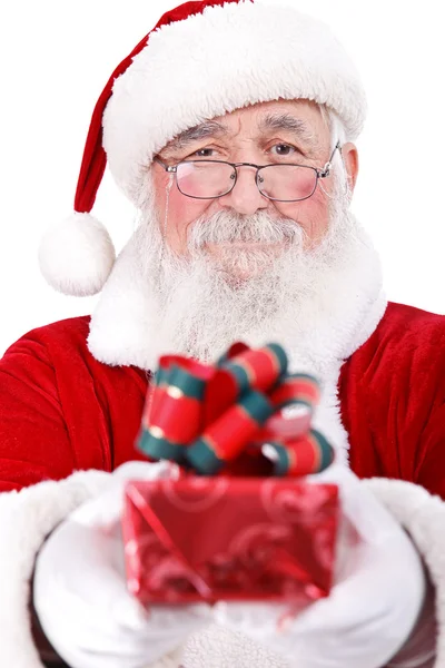 Santa giving present for Christmas Stock Picture