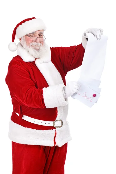 Santa läsning önskemål av barn — Stockfoto