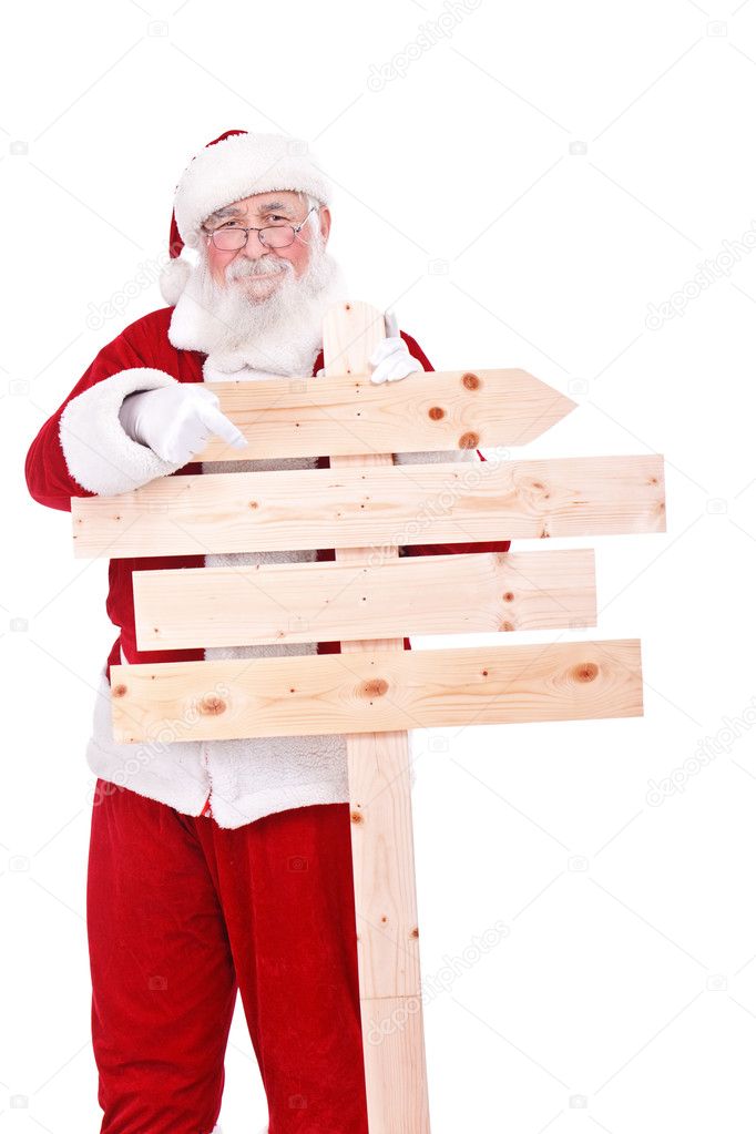 Santa pointing in wooden sing