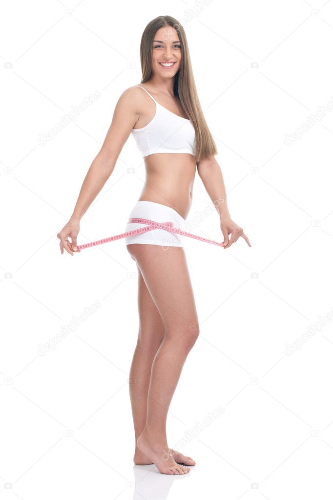 Young woman measuring hips