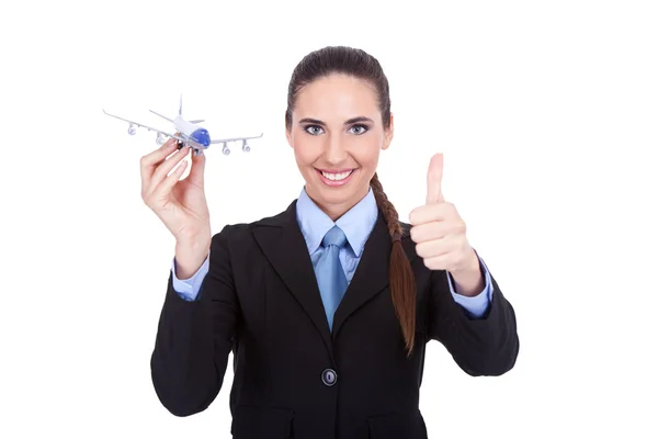 Atractiva azafata sosteniendo avión —  Fotos de Stock