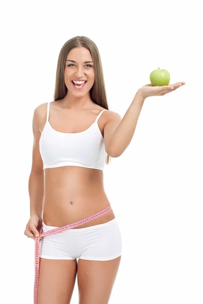 Mulher magro e apto com fita métrica e maçã — Fotografia de Stock