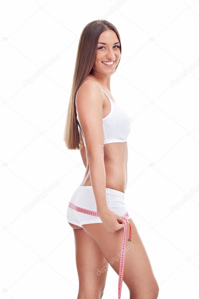 Slim girl measuring her buttocks