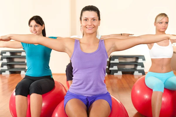 Girls in the gym exercise — Stock Photo, Image