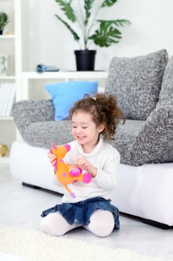 Girl and her favorite soft toy clipart