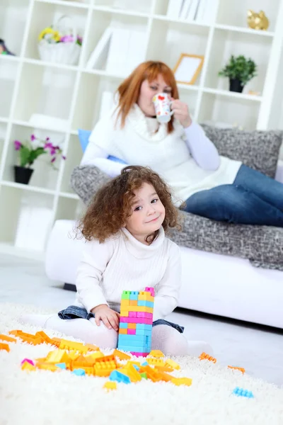 Girl playing with her toys — Stock Photo, Image