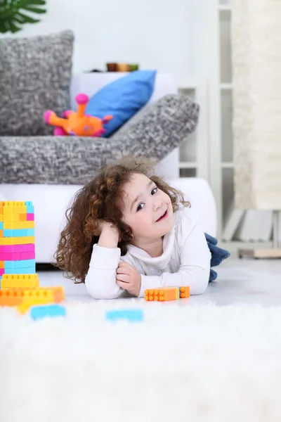 Cute girl with her toys — Stock Photo, Image