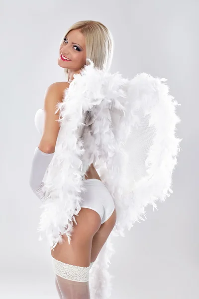 Beautiful woman smiling with angel wings on the back — Stock Photo, Image