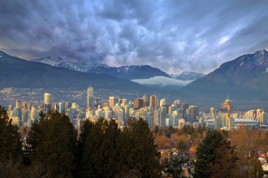 Vancouver BC City Skyline with Mountains clipart