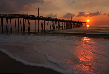 Sunrise over a fishing pier in North Carolina clipart